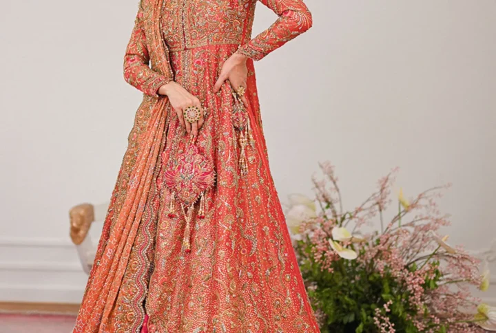 Coral Bridal Lehenga with gold zari and dabka work.