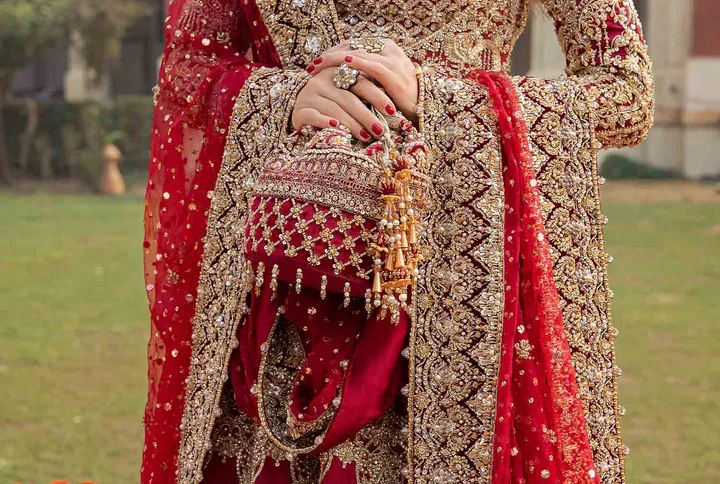 Ruby Red Bridal Dress with intricate gotta and zardozi work.